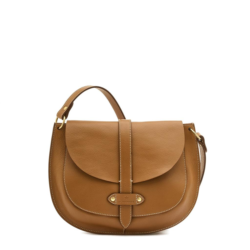 Brown leather saddle bag with curved flap