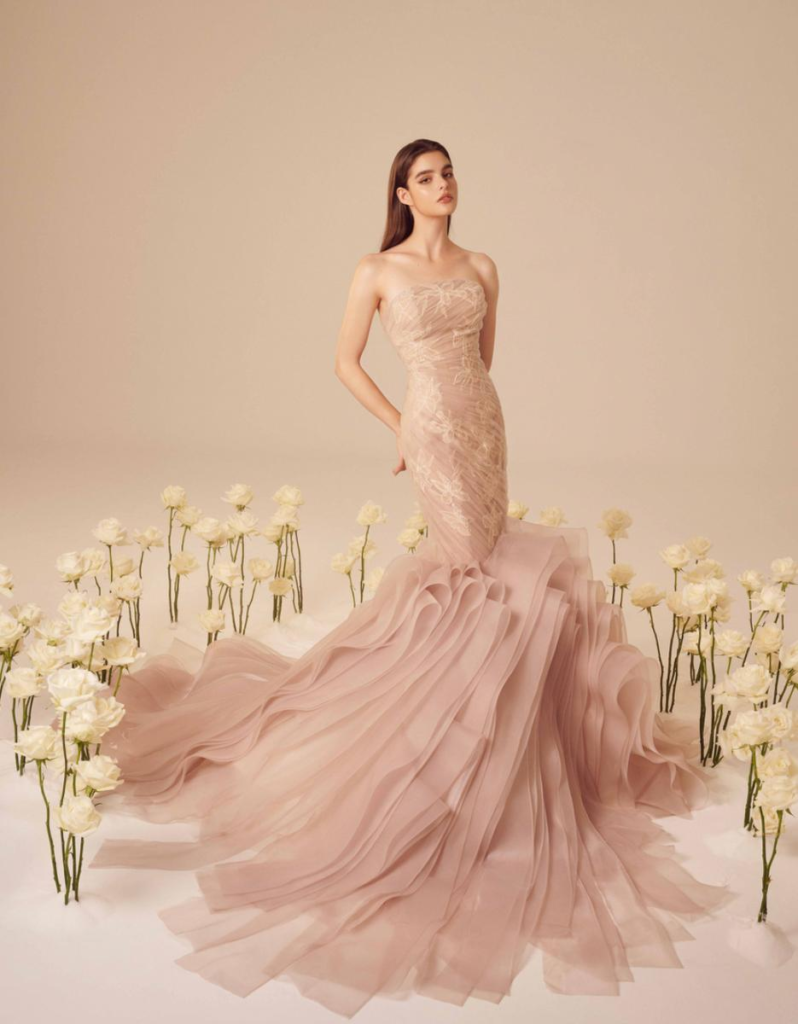 Pink mermaid wedding gown fitted through the hips with flared skirt