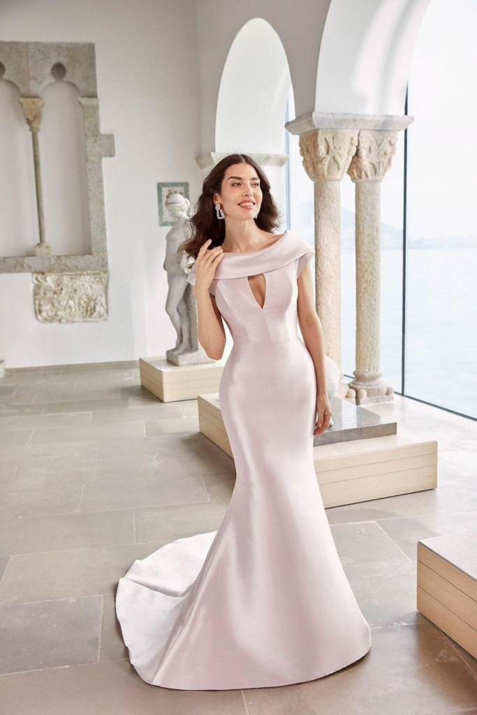 Simple pink wedding dress with boat neckline and clean lines