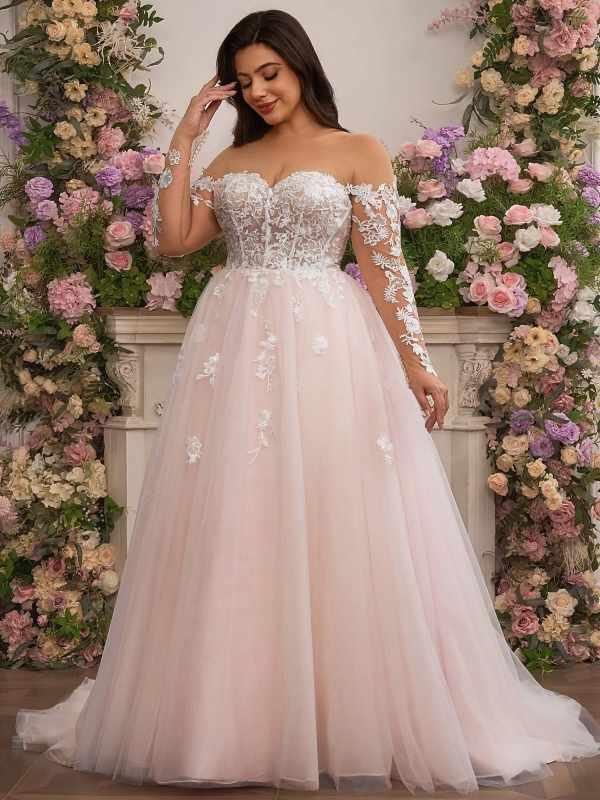 Plus-size pink wedding gown with flowing A-line skirt