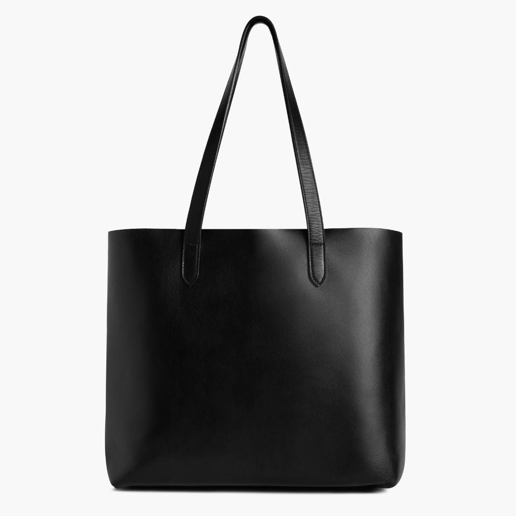 Large black leather tote bag with two handles